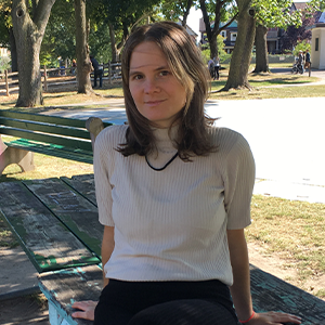 picture of natalia sitting on park bench