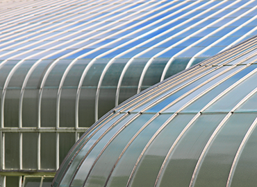 close up of curved glass building facade